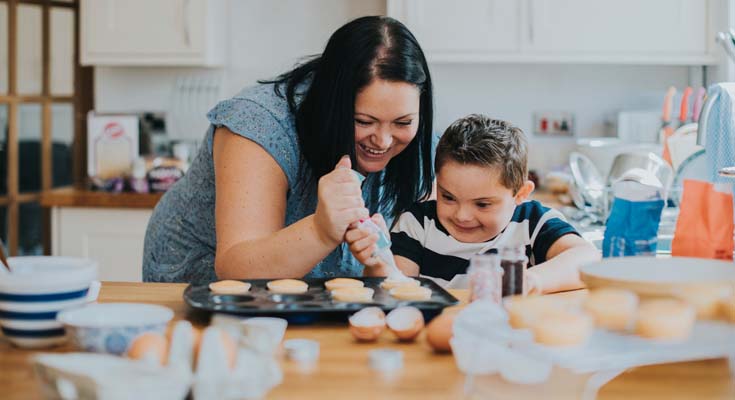 Woman baking with a young child
