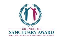 Council of Sanctuary Award logo with a blue and maroon figure joining hands above their heads surrounded by laurel and the slogan "Welcoming people seeking sanctuary".