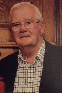 Peter Henderson wearing a white shirt and a dark grey suit jacket