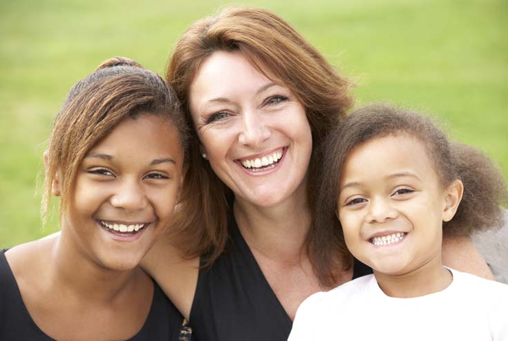 White woman with mixed heritage children